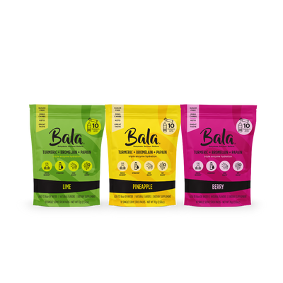 Three packages of Everyone's Favorite Bundle supplement drink mix by Bala Enzyme are displayed. From left to right, the flavors are Lime, Pineapple, and Berry. Each pack promotes total body wellness and indicates the inclusion of turmeric, bromelain, and papain for muscle recovery.